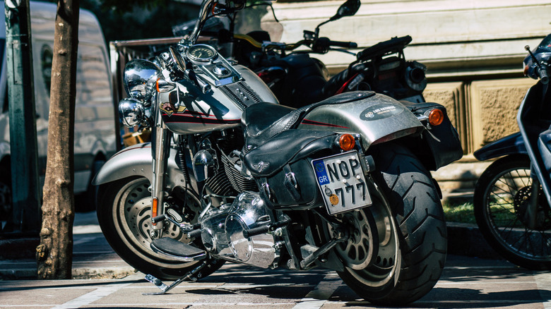 Steel grey Fat Bob motorcycle, rear view, Greece license plate