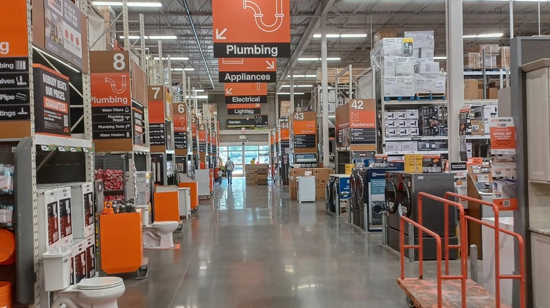 Perusing the aisles inside a Home Depot store.
