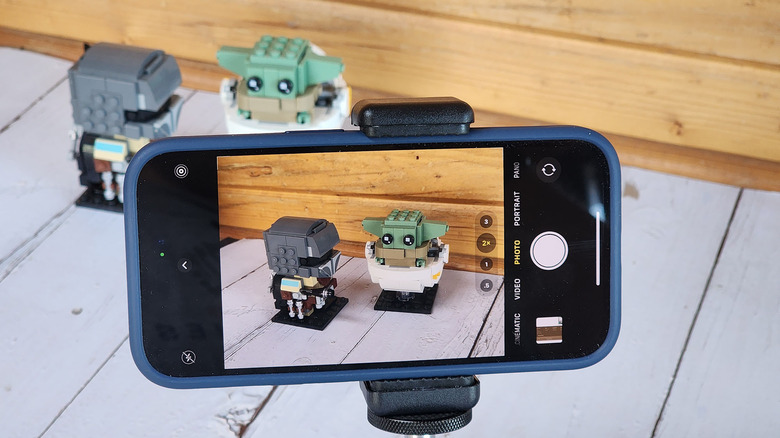 iPhone 14 taking a photo of Lego characters