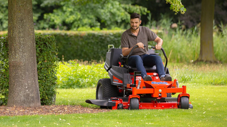 Man on Simplicity riding lawn mower