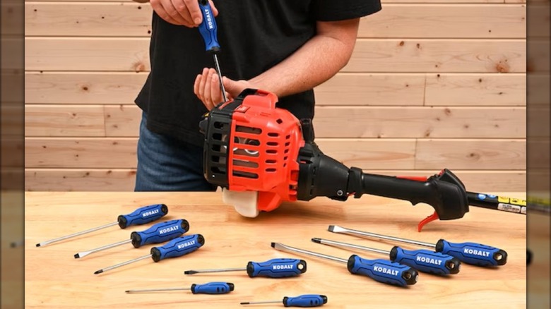 Using the Kobalt 10-piece screwdriver set to repair a string trimmer.
