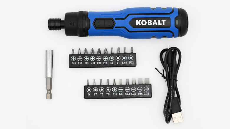 The Kobalt 1/4 Inch Cordless Screwdriver with driver bits, an extention, and a charging cable.