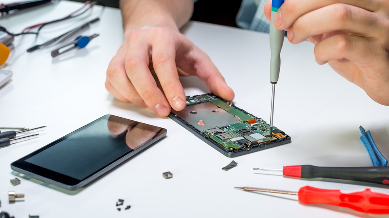 Person repairing phone