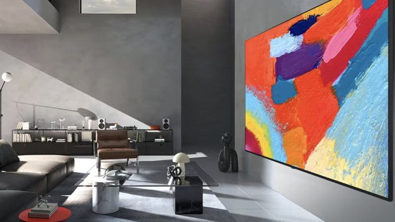 A massive LG Micro RGB television mounted on a wall in a modern living room