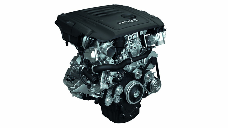 A side view of the 2.0 liter Ingenium Diesel version that powers a Jaguar SUV against a white studio background.