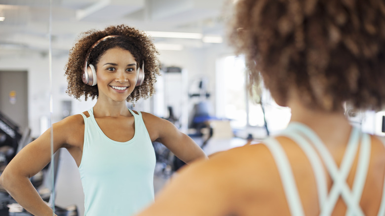 woman at the gym with over-ear headphones