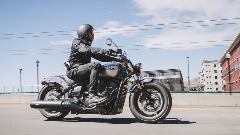 Man in black gear riding Indian Motorcycle