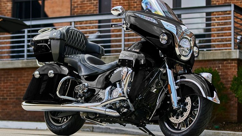 Black Indian Roadmaster Motorcycle In Front of a Brick Wall