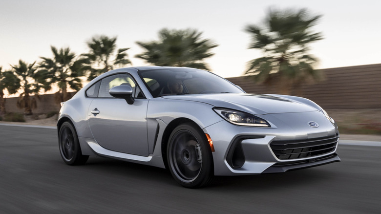 Silver 2022 Subaru BRZ driving on a road at sunset