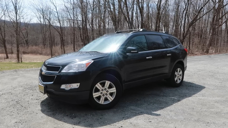 A black 2010 Chevrolet Traverse parked