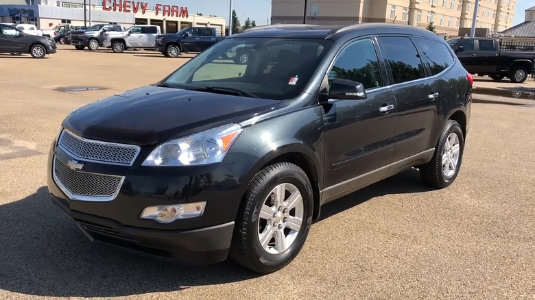 A black 2012 Chevrolet Traverse parked
