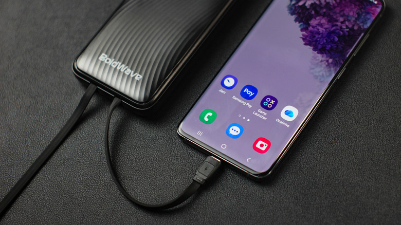 A power bank connected to a smartphone