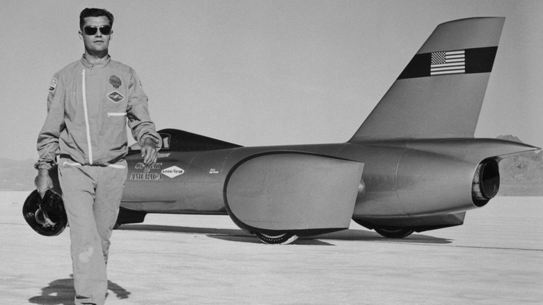 Craig Breedlove walking away from the Spirit of America land speed car at the Bonneville Salt Flats.