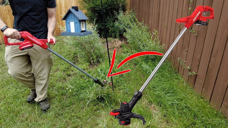 A man holding a battery-powered Craftsman weed eater