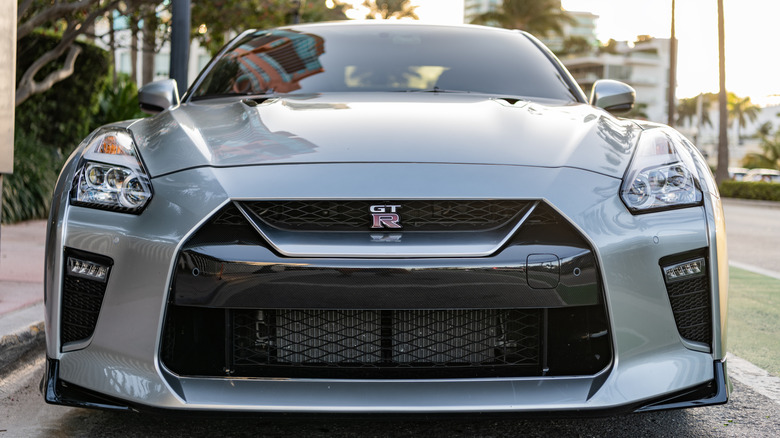 A front-end close-up of a silver Nissan R35 GT-R
