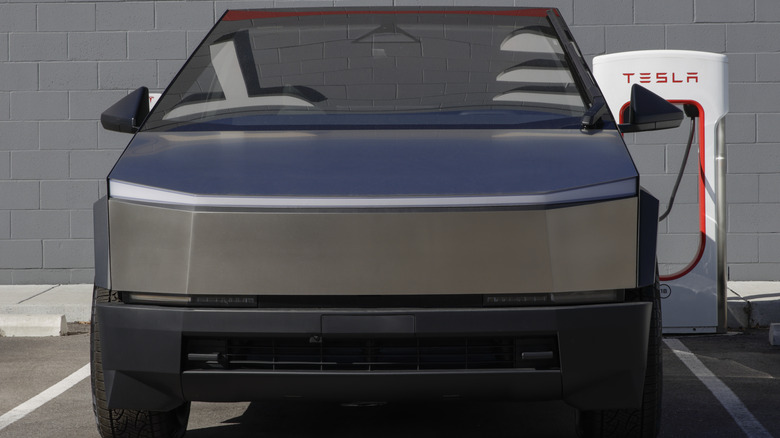 A front-end close-up of a silver Tesla Cybertruck