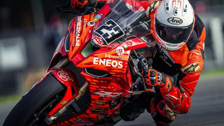A motorcycle racer on a closed course track.