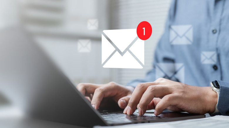 A concept of an email with a person using a laptop