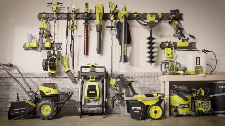 Ryobi outdoor tools on a wall