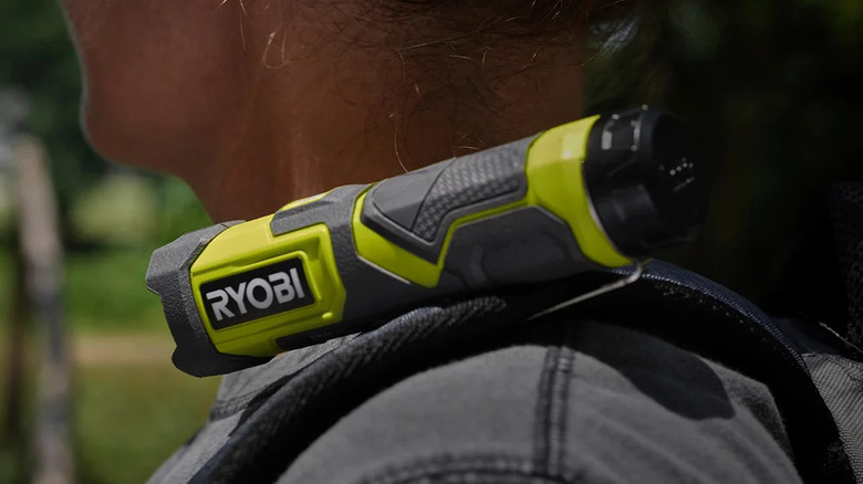 Ryobi USB Lithium compact flashlight mounted to a backpack