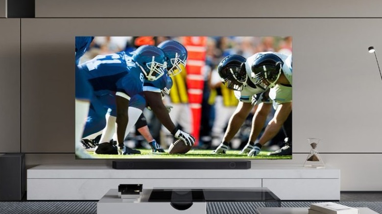 A Samsung Smart TV showing a football game up close.