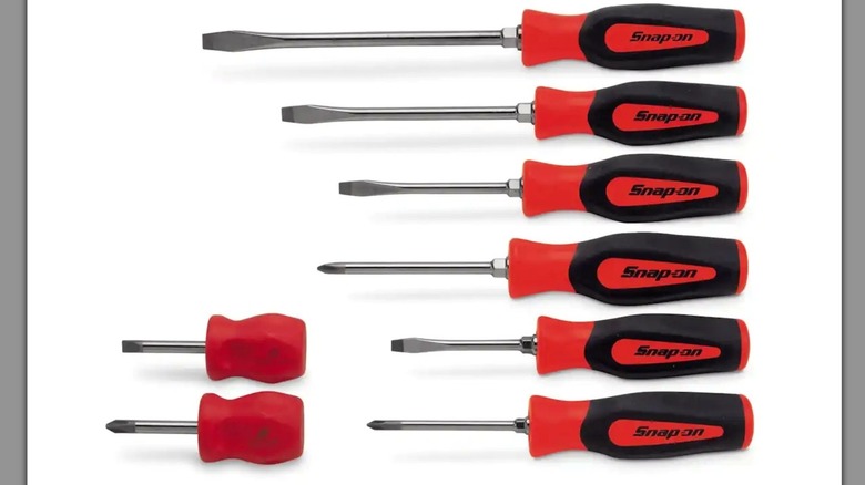 A set of eight Snap-On screwdrivers with red and black handles