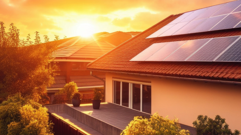 picture advertizing SunPower showing the sun setting over house with solar panels
