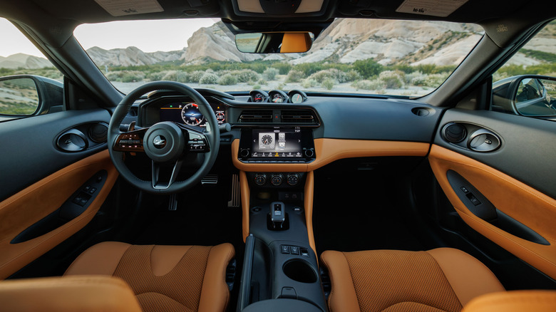 Nissan Z interior, looking through windshield at desert setting with mountains