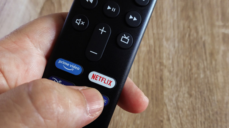 Person holding an Amazon Fire TV remote