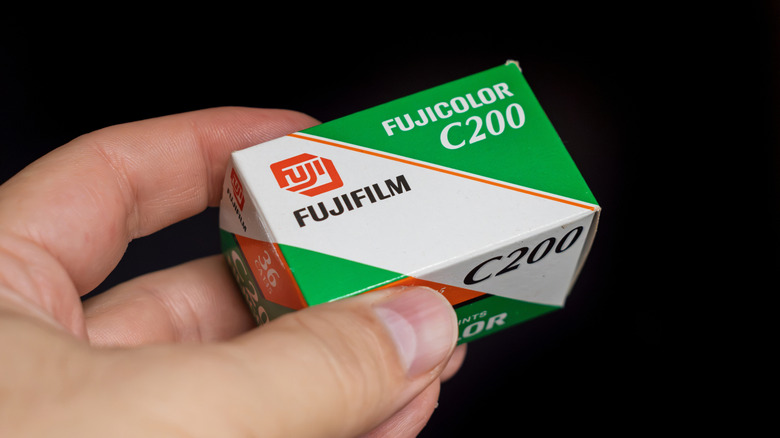 person holding a box for a roll of Fujifilm Fujicolor C200 35mm film