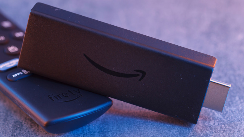 Amazon Fire TV stick photographed close up with HDMI connector visible