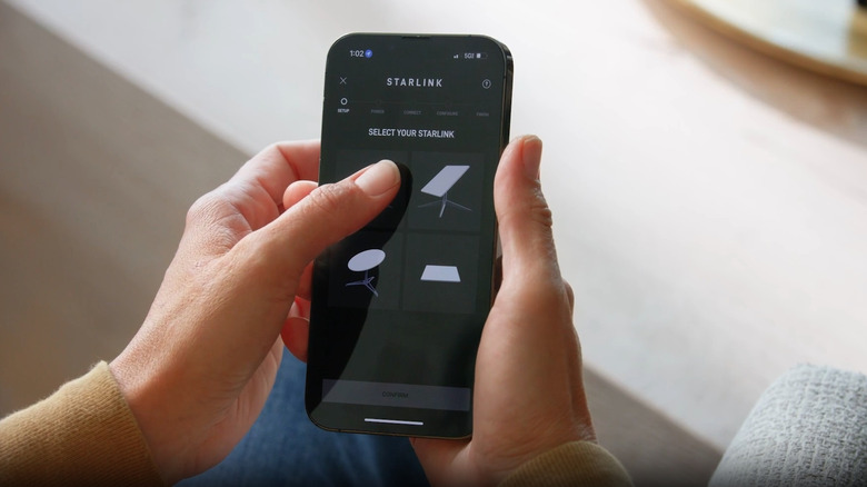 Person selecting their Starlink dish on the app