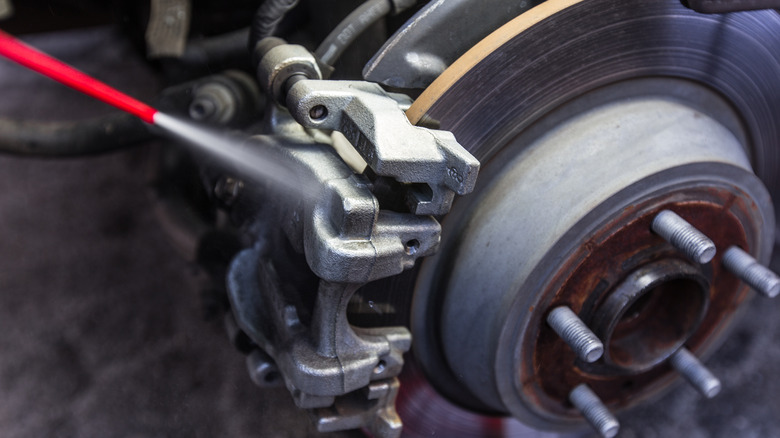 sparing brake cleaner on caliper