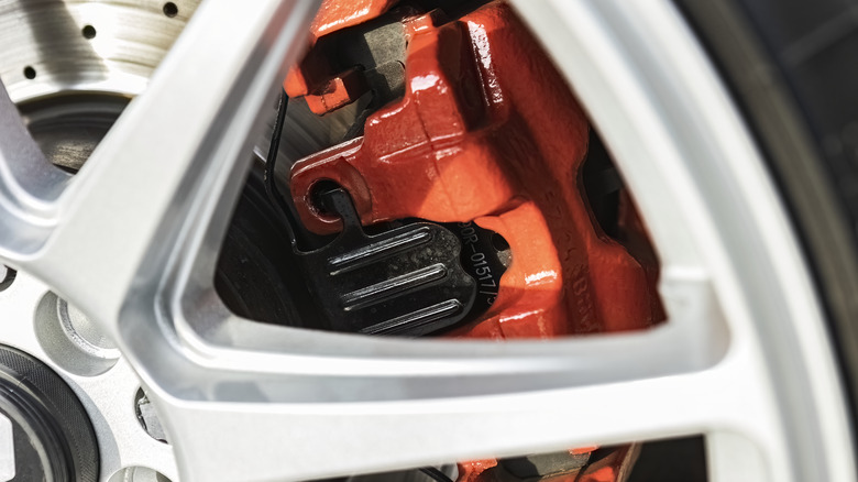 Painted brake calipers behind wheels
