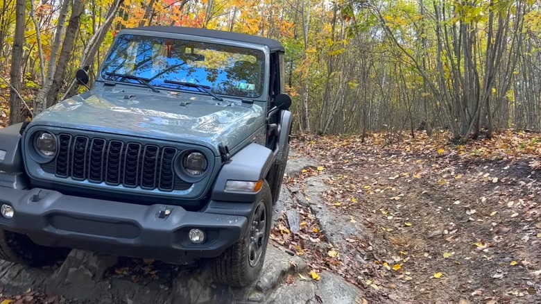 A 2024 Wrangler two-door on a forested trail