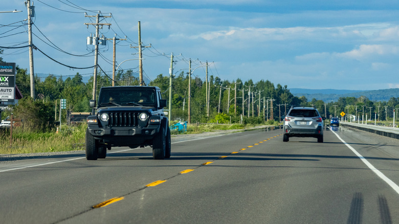 A Jeep Wrangler traveling along a highway