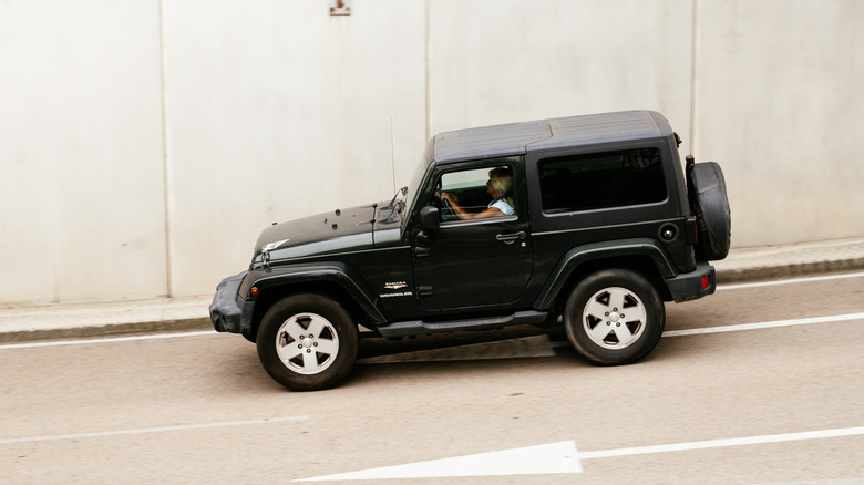 Side view of a Jeep Wrangler showcasing its boxy shape