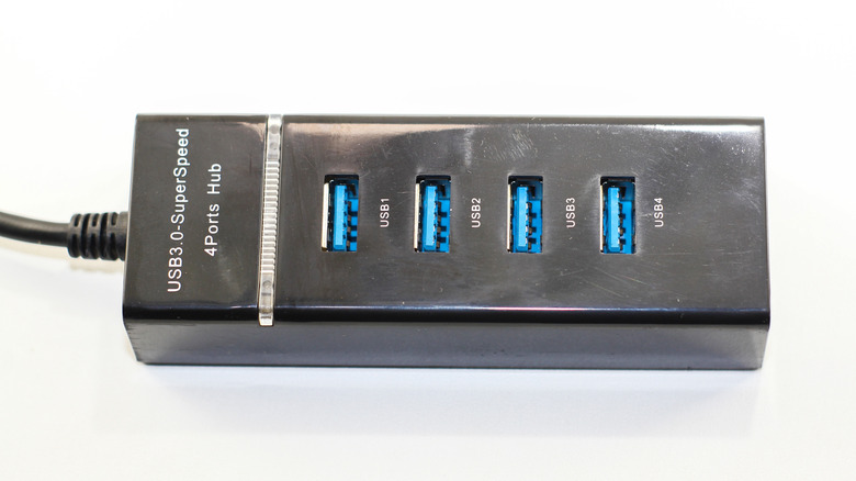 A USB hub with multiple USB 3.0 ports, white background