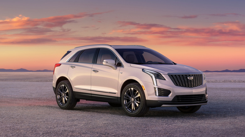 2025 Cadillac XT5 parked on salt pan during sunset, front-right 3/4 view