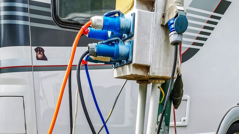 A fully-utilized electrical pedestal at an RV park.