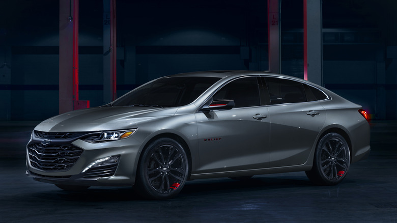 Front 3/4 view of Chevrolet Malibu in garage setting