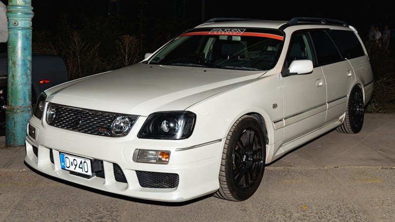 Nissan Stagea at a car show at night