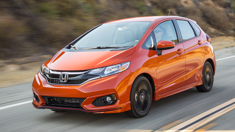 Orange 2020 Honda FIt on highway