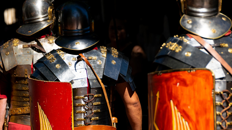 Roman army reenactment soldiers marching.