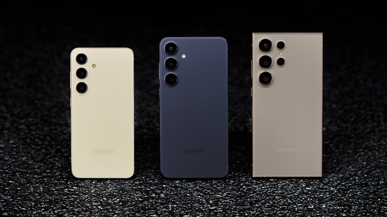 A lineup of Samsung Galaxy S24 smartphones on a black surface