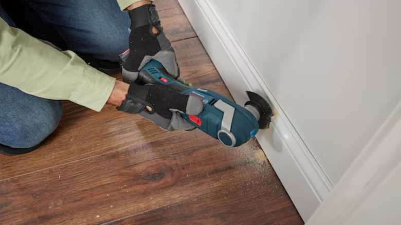 Bosch 18-volt cordless oscillating multi-tool at work on job