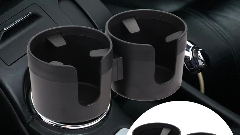 Two cupholder extenders in a car's center console.