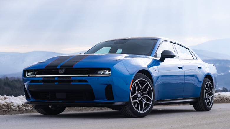 Front 3/4 view of Dodge Charger in mountainous snowy setting