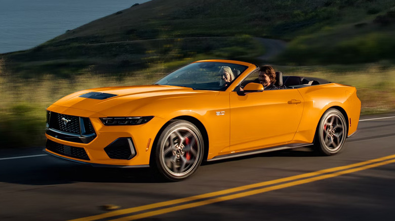 A yellow 2026 Ford Mustang convertible on the road