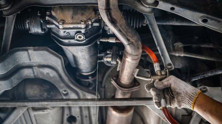 Differential fluid being serviced